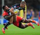 Exeter's Gareth Steenson gets caught by Manu Tuilagi
