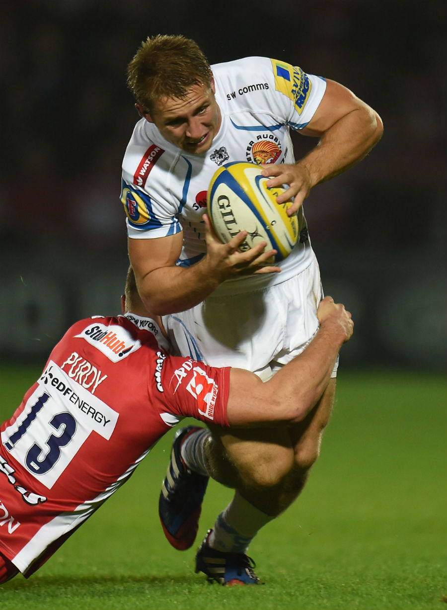 Exeter Chiefs' Sam Hill is tackled by Gloucester Rugby's Henry Purdy