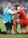 Geoff Parling receives attention before leaving the pitch with concussion