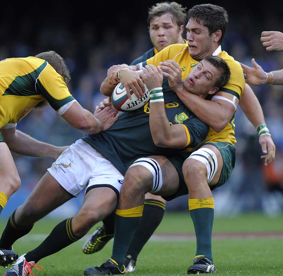 South Africa's Handre Pollard is halted by the Australian defence