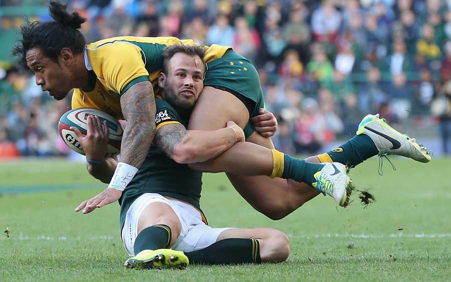 Australia's Joe Tomane is brought down by Francois Hougaard