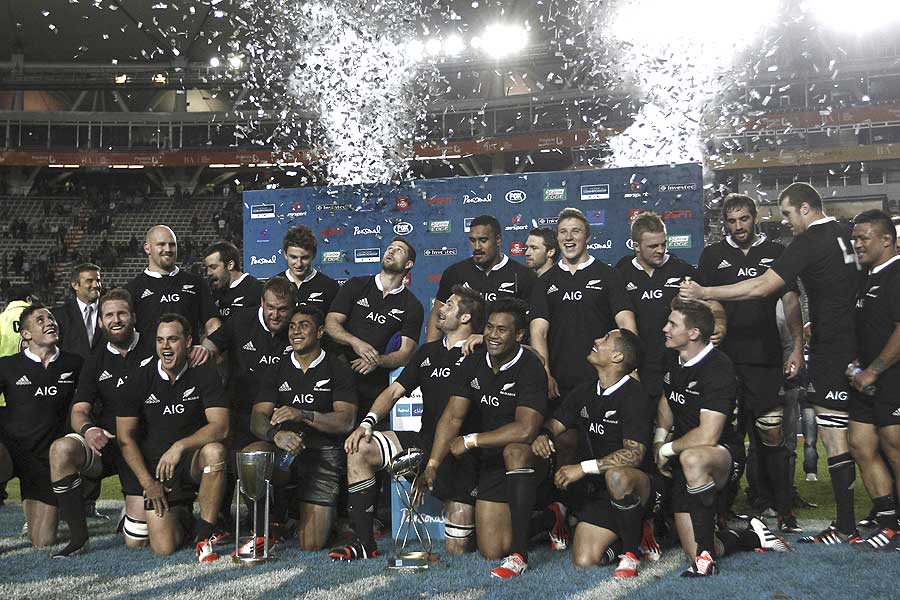 The All Blacks celebrate with the champions trophy of The Rugby Championship 