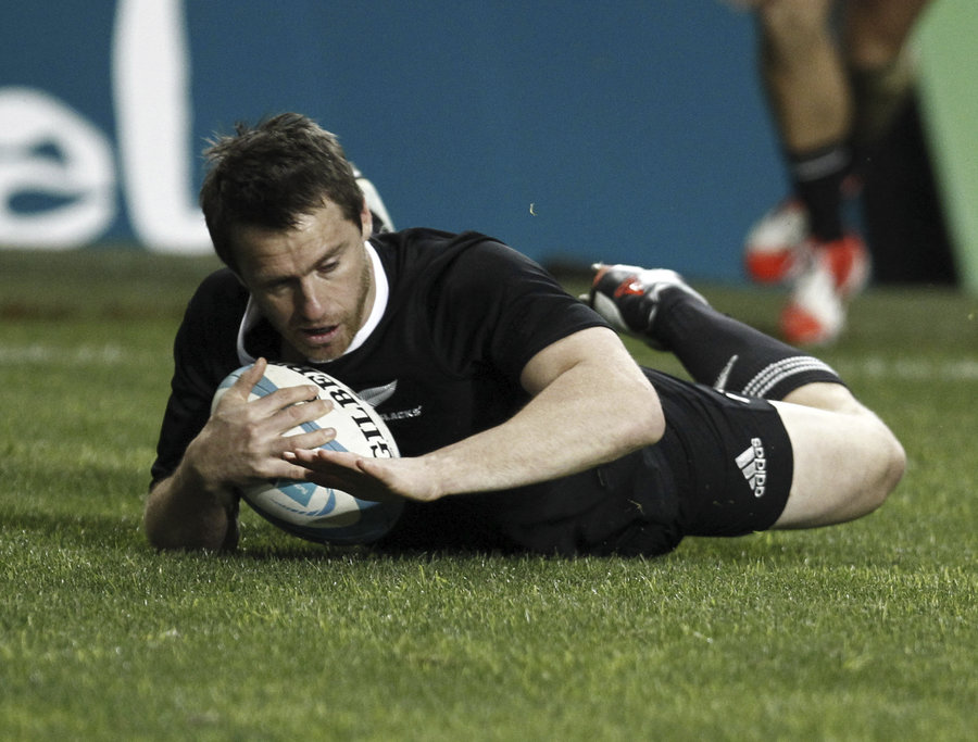 Ben Smith of New Zealand dives for a try