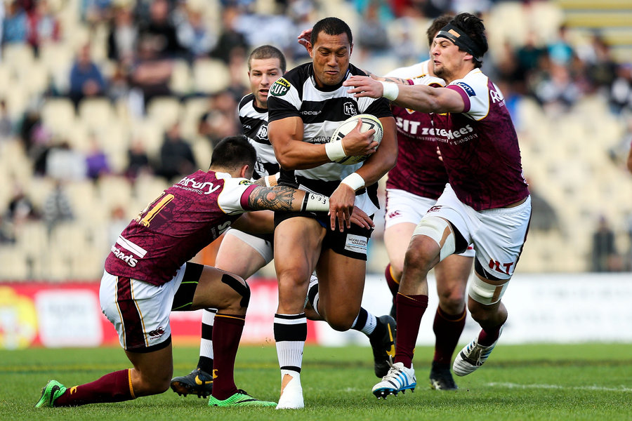 Robbie Fruen of Hawke's Bay is tackled by Elliot Dixon and Keanu Kahukura of Southland