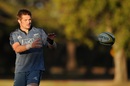 Richie McCaw receives a pass during an  All Blacks training session in Brisbane