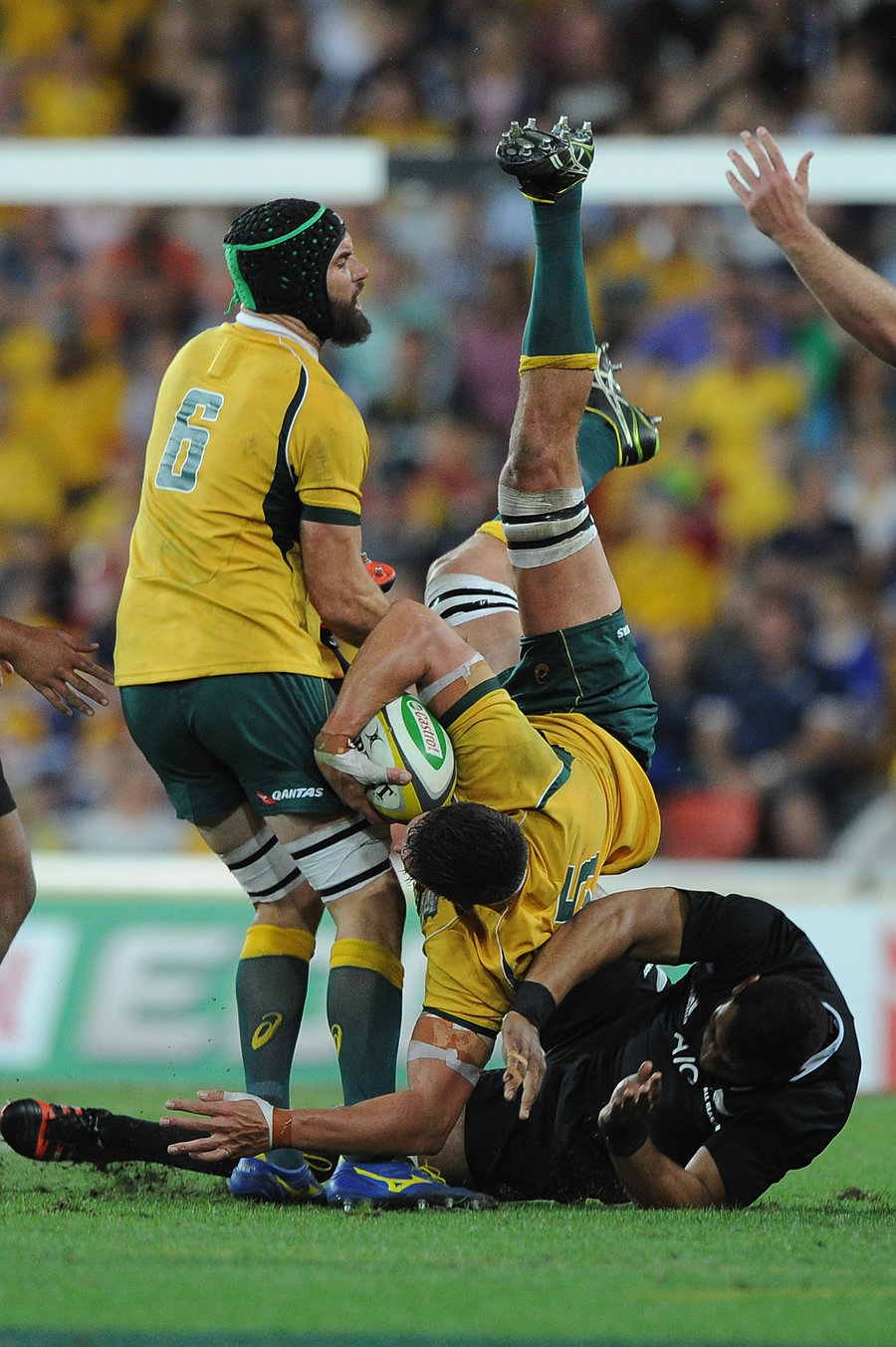 Wallabies' Rob Simmons is taken out in the air by Patrick Tuipulotu