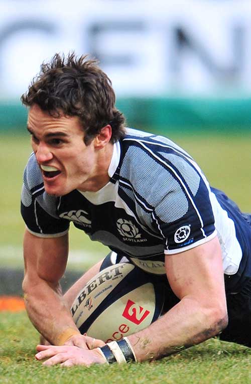 Scotland wing Thom Evans dives in to score against France