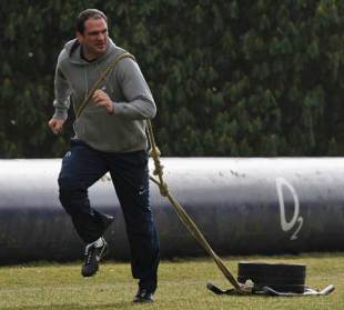 England manager Martin Johnson pulls a weight sled during a training session, Pennyhill Park Hotel, Bagshot, England, February 19, 2009 