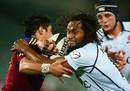 Waratahs wing Lote Tuqiri crashes in to the Highlanders defence