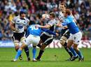 Scotland fly-half Phil Godman gets trapped by the Italy defence