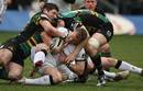 Jamie Noon of Newcastle is tackled by James Downey and Christian Day