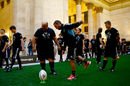 Aaron Cruden kicks a ball during a New Zealand All Blacks community skills session