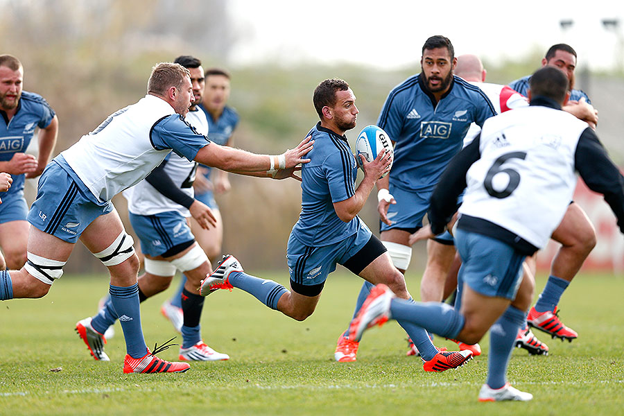 New Zealand's Aaron Cruden runs the ball during a training session