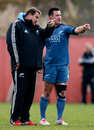 New Zealand coach Steve Hansen shows Ryan Crotty the way in training