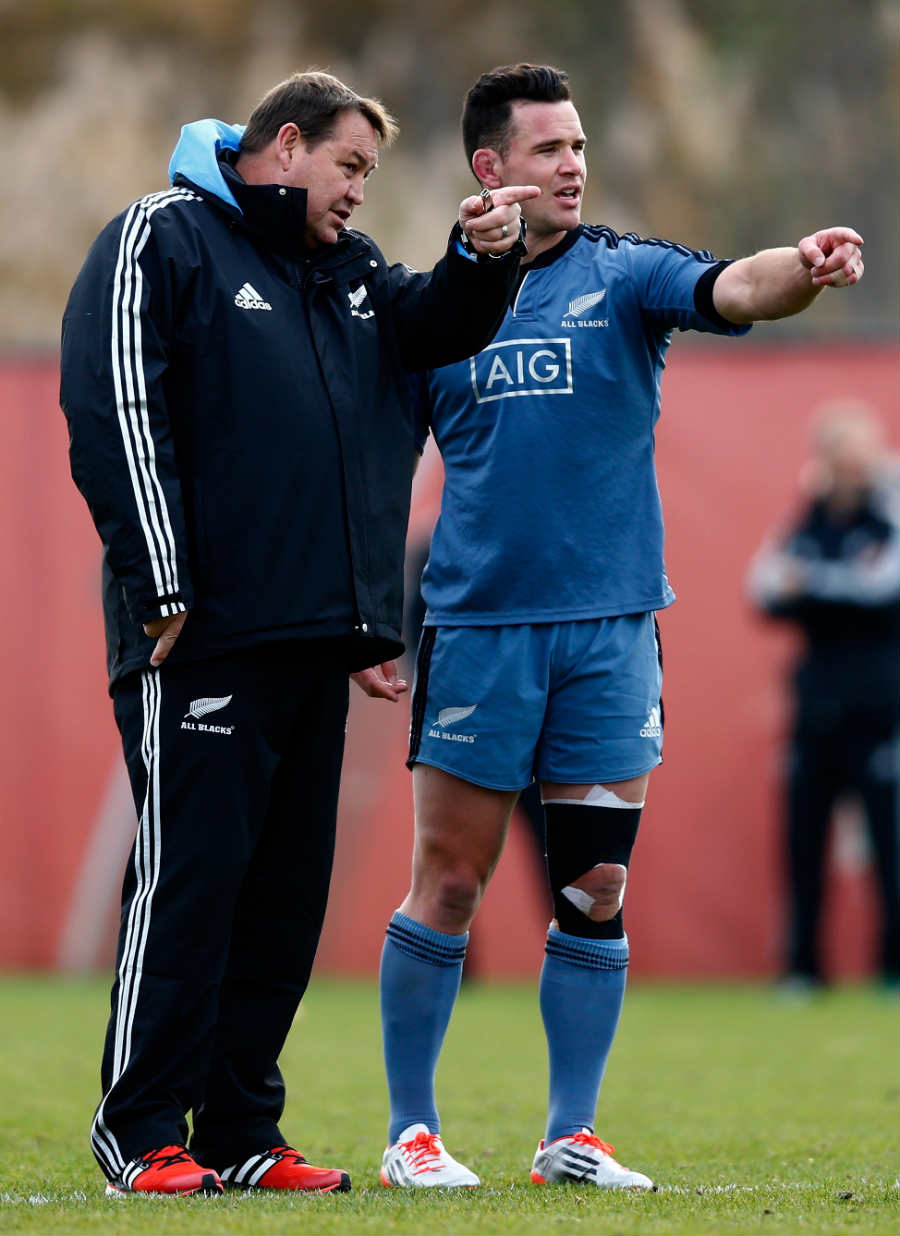 New Zealand coach Steve Hansen shows Ryan Crotty the way in training