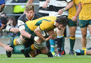 Australia's Sam Carter dives over for a try against the Barbarians