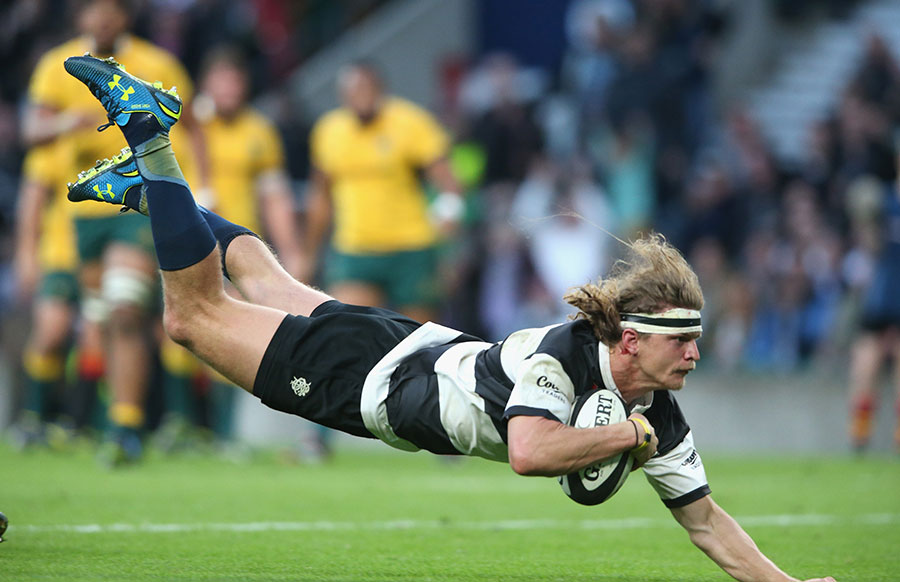 Nick Cummins dives over the line for his try for the Barbarians against his home nation of Australia