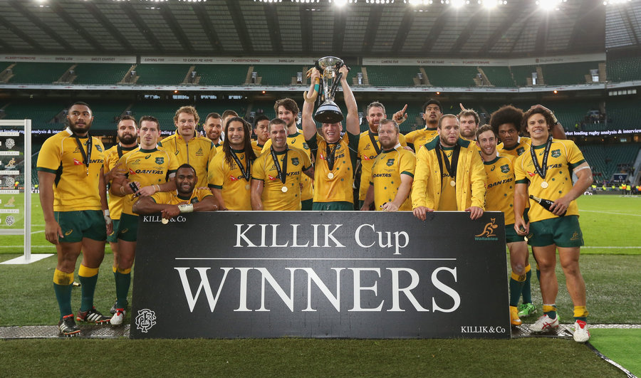 The Wallabies celebrate their victory over the Barbarians