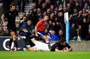 Richie McCaw dives over to score for New Zealand