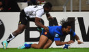 France winger Teddy Thomas scores a try beyond Fiji's Watisoni Votu 