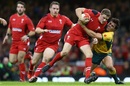 Rhys Priestland is tackled by Nick Phipps of Australia