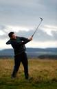 New Zealand's Richie McCaw hits out of the rough as the All Blacks enjoy a round of golf