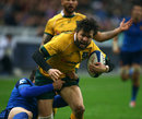 Adam Ashley-Cooper of Australia trys to break through France's Remi Tales tackle