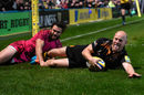 Joe Simpson celebrates as he goes over for another Wasps try