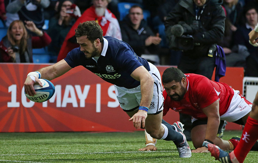 Scotland centre Alex Dunbar lunges over for his try in the second half