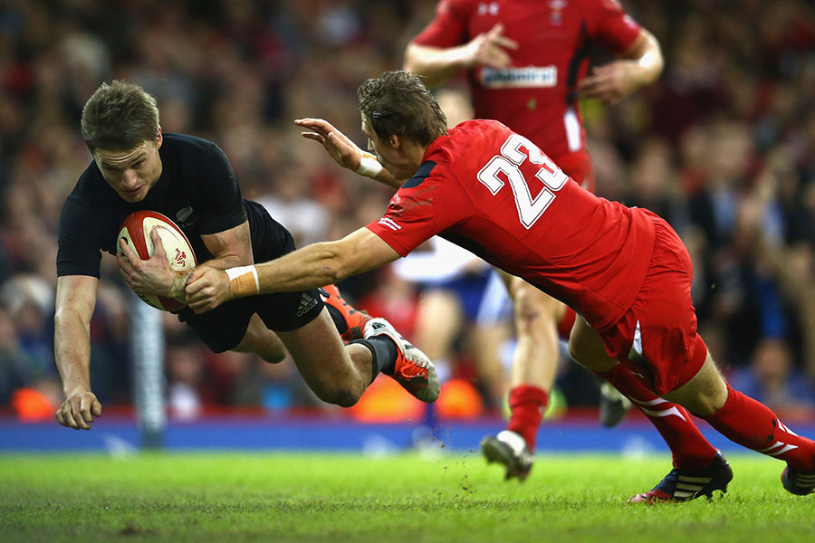 Beauden Barrett dives over for the first of his two tries against Wales