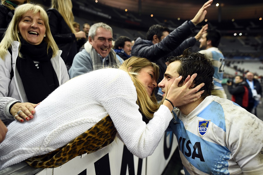 Argentina fly-half Nicolas Sanchez is congratulated by his girlfriend after beating France
