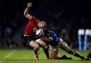 England's Mike Brown is snagged by Alapati Leiua of Samoa