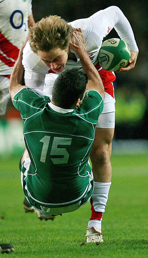 England's Matthew Tait is tackled by Ireland's Rob Kearney