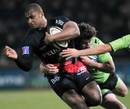 Toulouse centre Malell Kunavore is tackled by Montauban fly-half Regis Lespinas