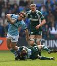Leicester's Julien Dupuy is tackled by London Irish's Paul Hodgson