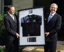 New Zealand Prime Minister John Key presents Australian Prime Minister Kevin Rudd with a New Zealand All Blacks shirt