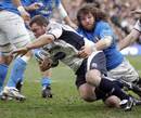 Scotland's Allan Jacobsen is tackled by Italy's Martin Castrogiovanni