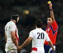 Referee Craig Joubert shows England's Danny Care a yellow card