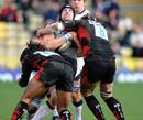 Sale's Sean Cox is tackled Saracens' Ben Skirving and Noah Cato