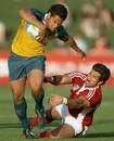 Brian Sefanaia of Australia breaks clear of the Portugal defence