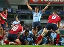 The Waratahs' Luke Burgess celebrates as Benn Robinson forces his way over for a try