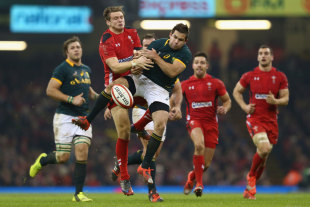 Dan Biggar (left) challenges for a high ball with Cobus Reinach, Wales v South Africa, Autumn International, Millennium Stadium, Cardiff, Wales, November 29, 2014