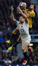 Adam Ashley-Cooper wins a high ball over Mike Brown