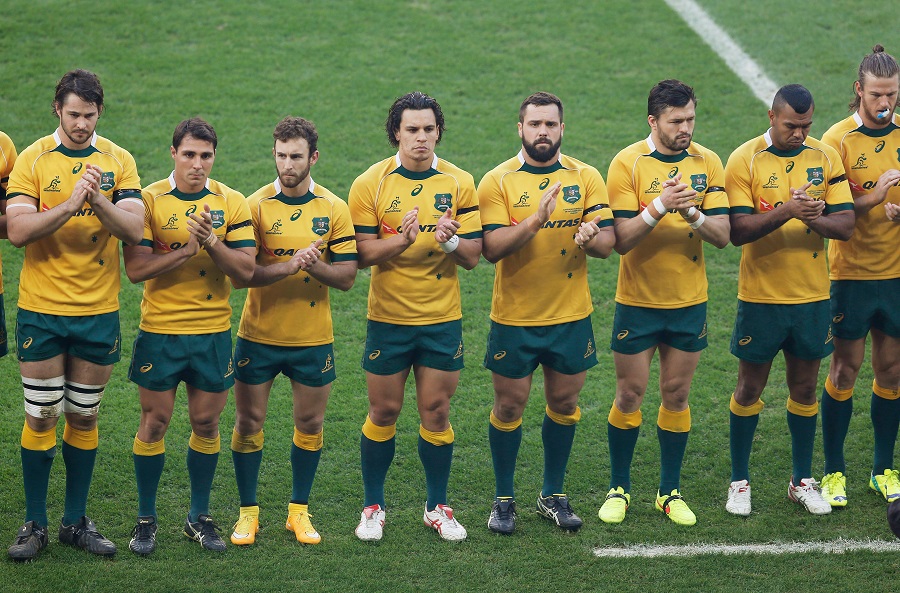 Australia's players join in with the minute's applause at Twickenham in memory of cricketer Phillip Hughes