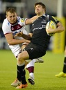Adam Powell of Newcastle Falcons is challenged by Jonathan Mills of Sale Sharks