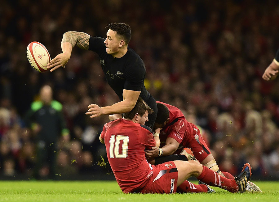 Sonny Bill Williams offloads while being tackled