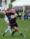 Tom Stephenson of Northampton Saints is tackled by Michele Campagnaro