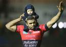 Toulon's Bryan Habana salutes the crowd with his son Timothy on his shoulders
