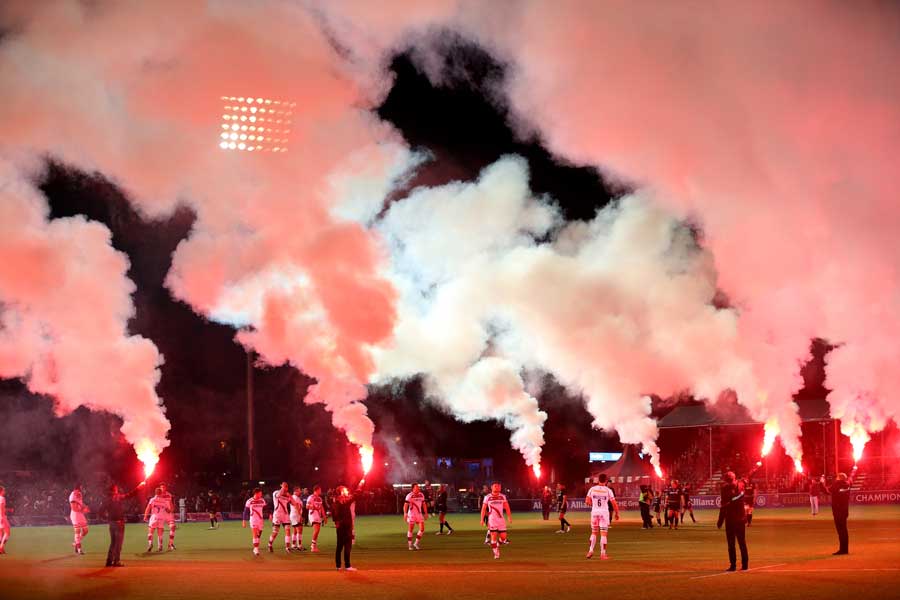 Flares greet the arrival of the Saracens players