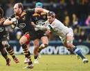 Wasps' Andy Goode is tackled by Yannick Caballero